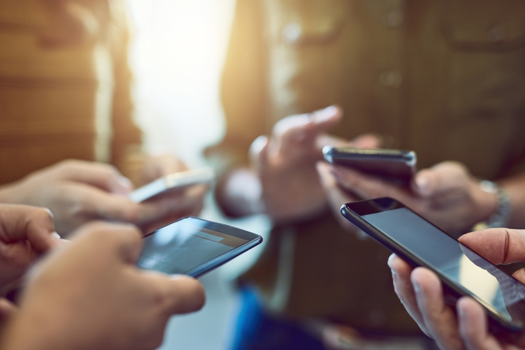an image showing many people using smart phones together