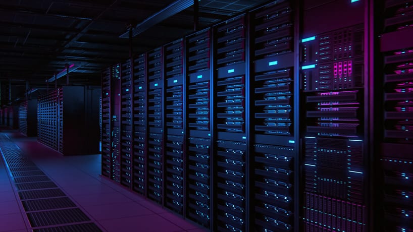 the inside of a data centre showing many racks of computer equipment