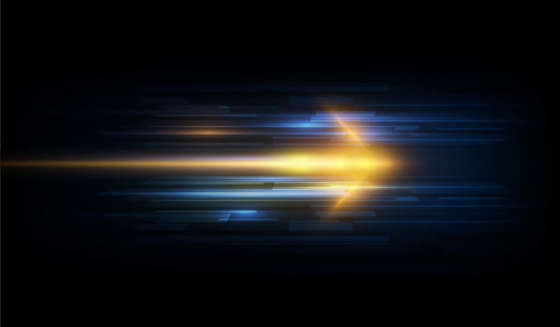 a blurred arrow of lights showing speed